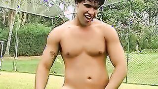 Horny Brazilian jock jerking off his throbbing cock outdoors