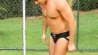 Horny Brazilian jock jerking off his throbbing cock outdoors