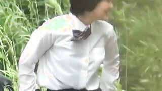 Adorable Japanse student with braids pees in the breeze