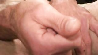 Older tattooed homo jerks off his big dick in the bedroom