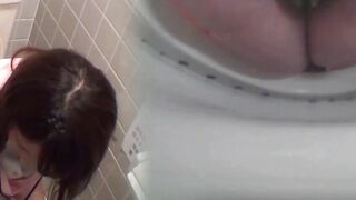 Unaware Japanese female workers pee on a hidden cam