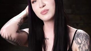 Tattooed slave suspended and tormented in upside down position