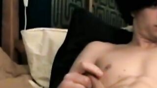 Handsome looking twink strokes his big dick on webcam solo