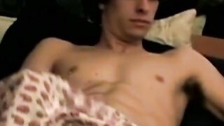 Handsome looking twink strokes his big dick on webcam solo