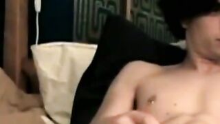 Handsome looking twink strokes his big dick on webcam solo