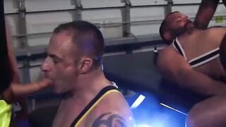 Tattooed hunks fucked bareback in interracial spitroast orgy