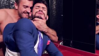 Two men in suits have sex in the toilet at work