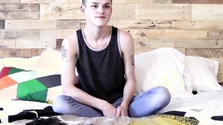 Inked twink jerks off and dildos his ass until he cums severely