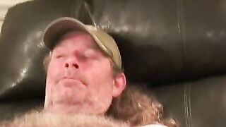 Mature lad with a hairy chest strokes his big hard dong hard