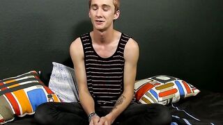Masturbating while attending an interview is a tatted man with a hairy cock