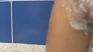 Gay Brazilian jerks off and dildoes his butt while washing