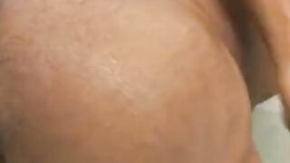Gay Brazilian jerks off and dildoes his butt while washing