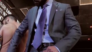 Businessmen with muscles banging after work hours