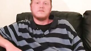 Redhead tugs his cut boner and tries his best to get hard