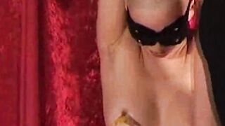 Bald babe restrained and tormented with hot wax in dungeon