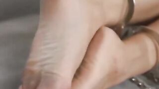 A sensual lesbian is tamed by a latex mistress to the point where they lick her pussy
