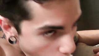 Young man sucks two cocks and receives cum in threesome