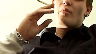 Tomy cant help rubbing his throbbing cock while smoking
