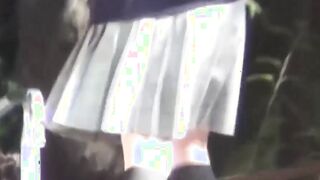Flavorful Japanese angel is peeing outside during day time