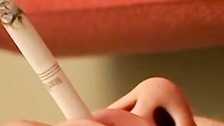 Bryce Corbin pleasing his rock hard cock with lit cig