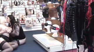 In a sex shop, Lacey Starr playsfully drills and eats out a cute girl