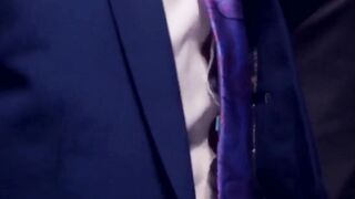 Two men in suits engage in sexual relations in the latrine at work