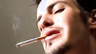 Axel loves pleasing his big dick with a blow of smoke