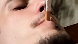 Axel loves pleasing his big dick with a blow of smoke