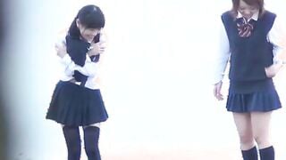 Three Japanese school  pissing hard together openly