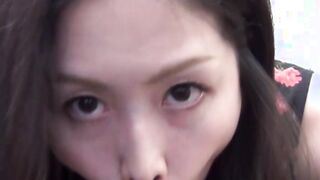 Handsome Oriental vixen stuffs mouth with plastic dick