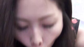 Handsome Oriental vixen stuffs mouth with plastic dick