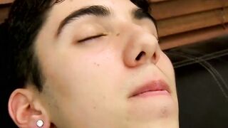 Young tattooed cutie moans while massaging his cock and balls