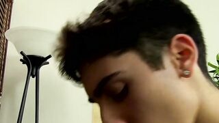 Young tattooed cutie moans while massaging his cock and balls