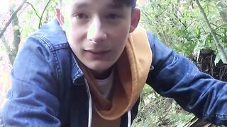 Perverted young gay dude tugs his big dick in the forest