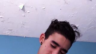 Seductive tattooed teenager teasing his big throbbing cock