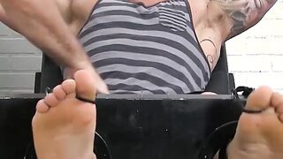 Huge muscular dude endures a feet tickling torment