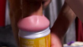 Young toy lover working on his big cock with a fleshlight