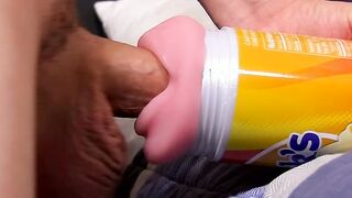 Young toy lover working on his big cock with a fleshlight