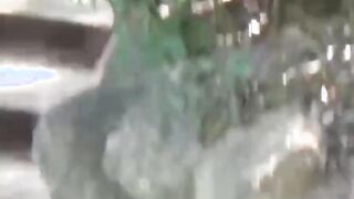 Japanese brunette squats while pissing outside