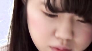 Asian dollface lifts her skirt up to show how she pees