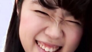 Asian dollface lifts her skirt up to show how she pees