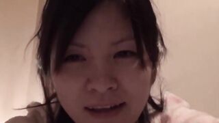 Japanese chick awakens and pees in a container while on the floor
