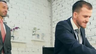 Hunk rimms in a suit and tie comfortingly pounding an irate boss