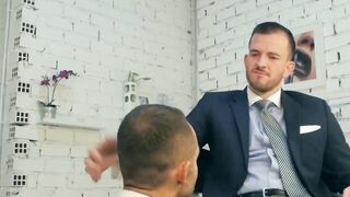 Hunk rimms in a suit and tie comfortingly pounding an irate boss