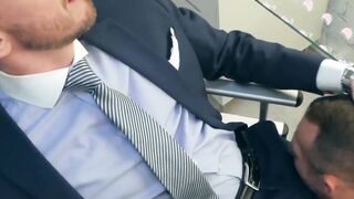 Hunk rimms in a suit and tie comfortingly pounding an irate boss