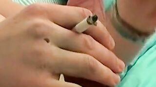 Mike Roberts blows a cloud of smoke while rubbing his cock