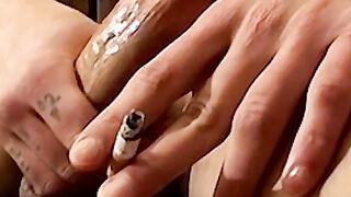 Smoking twink plays with his cock and enjoys it so much