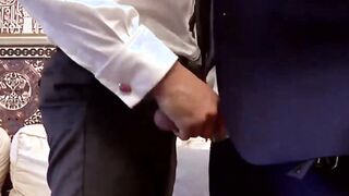 Two sophisticated office men wearing suits and ties in a hardcore anal