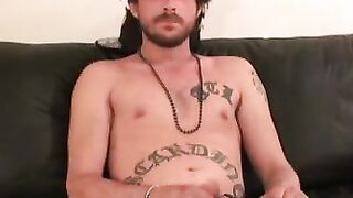 Inked thug rubbing hairy cock before solo cumshot