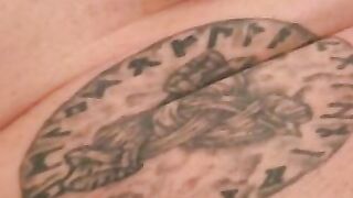Rough mature thug wanks cock with inked hand and cums